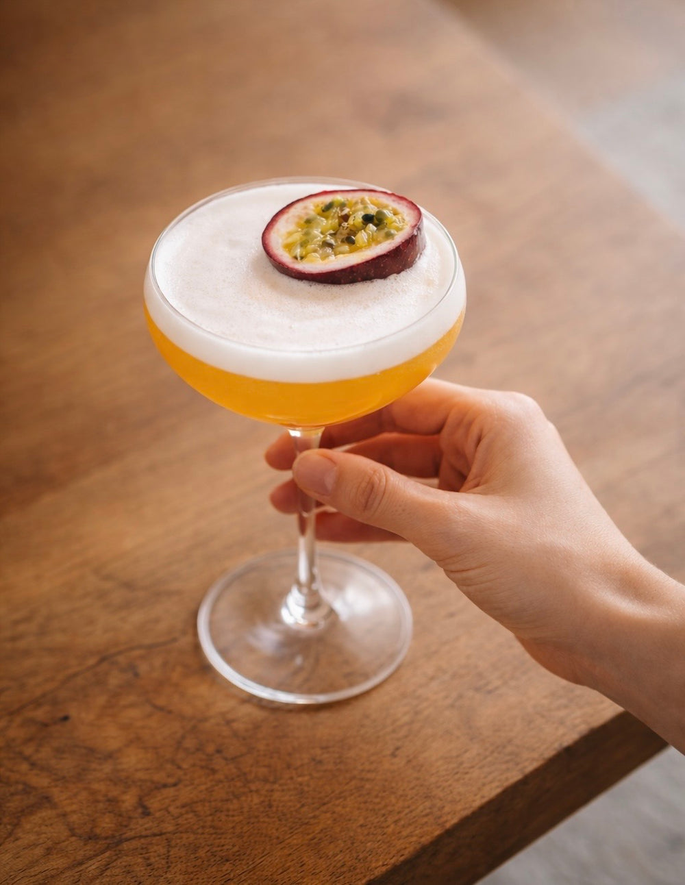Pornstar Martini cocktail made with Let's Mix mixer, served in a coupe with passion fruit